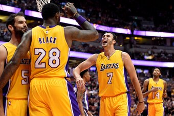 ANAHEIM, CA - OCTOBER 04:  Larry Nance Jr. #7 of the Los Angeles Lakers celebrates a play with Jose Calderon #5 and Tarik Black #28 during a preseason game against the Sacramento Kings at Honda Center on October 4, 2016 in Anaheim, California.  NOTE TO US