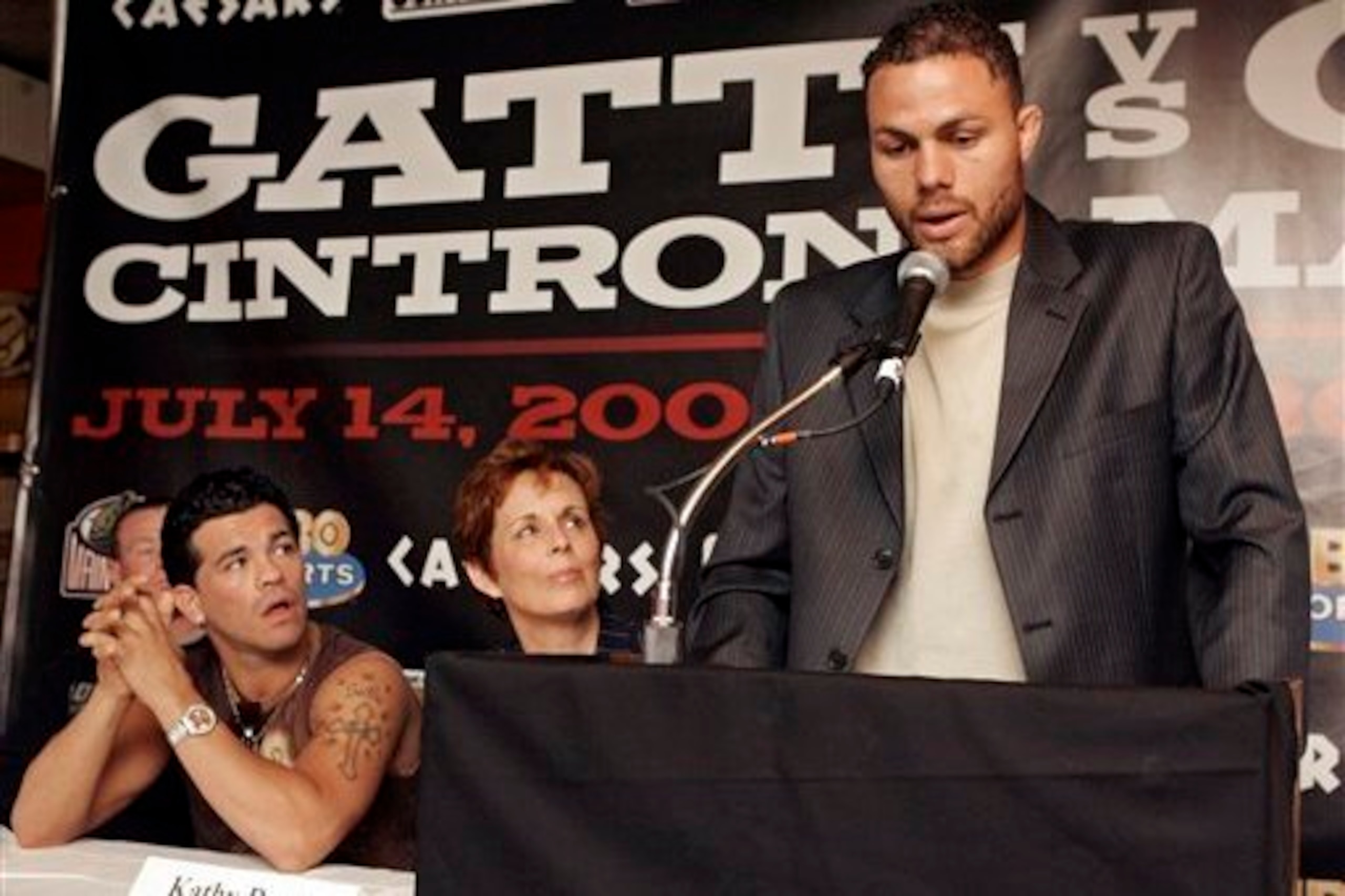 Duva and Gatti give Kermit Cintron all their attention.