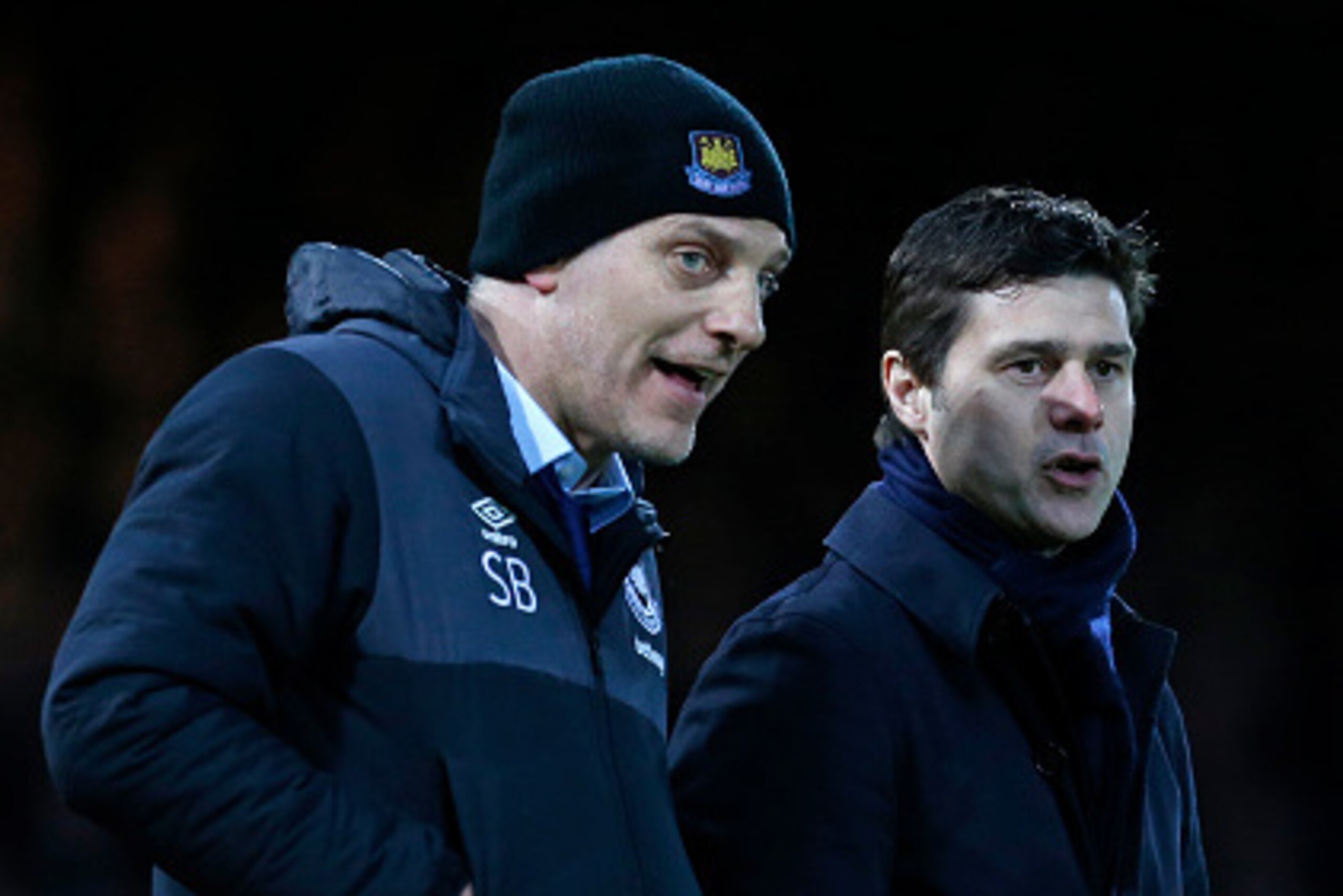 West Ham United's Croatian manager Slaven Bilic (L) and Tottenham Hotspur's Argentinian head coach Mauricio Pochettino talk on the touchline during the English Premier League football match between West Ham United and Tottenham Hotpsur at The Boleyn Groun