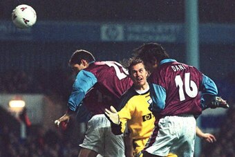 LONDON, UNITED KINGDOM - FEBRUARY 12:  Portugese soccer star Dani da Carvalho scores in his first full game beating Tottenham Goal Keeper Ian Walker and diving team mate Slaven Bilic, 12 February, for West Ham after signing from Sporting Lisbon.  Dani hea