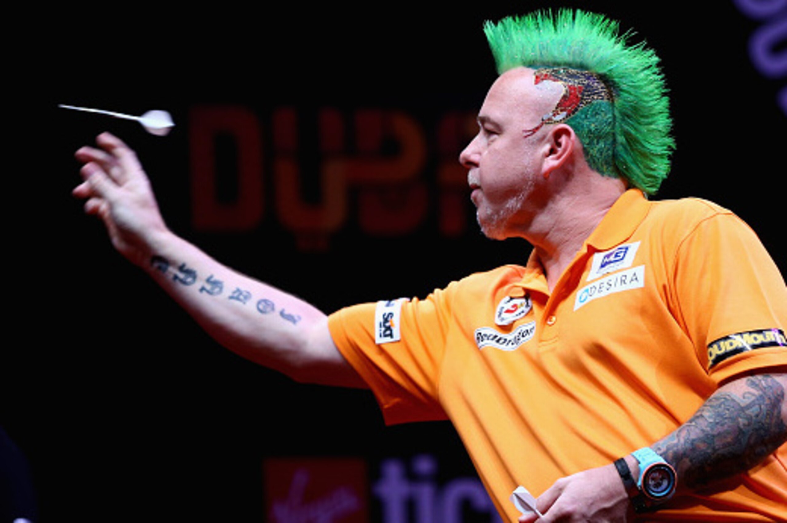 DUBAI, UNITED ARAB EMIRATES - MAY 28:  Peter Wright of Scotland competes aginst Phil Taylor of England during the 2015 Dubai Duty Free Darts Masters Quarter-Final match at Dubai Duty Free Tennis Stadium on May 28, 2015 in Dubai, United Arab Emirates.  (Ph