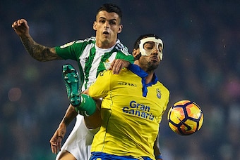 SEVILLE, SPAIN - NOVEMBER 18:  Alex Martinez of Real Betis Balompie (L) competes for the ball with Michel Macedo of UD Las Palmas (R) during the match between Real Betis Balompie vs UD Las Palmas as part of La Liga at Benito Villamarin stadium on November