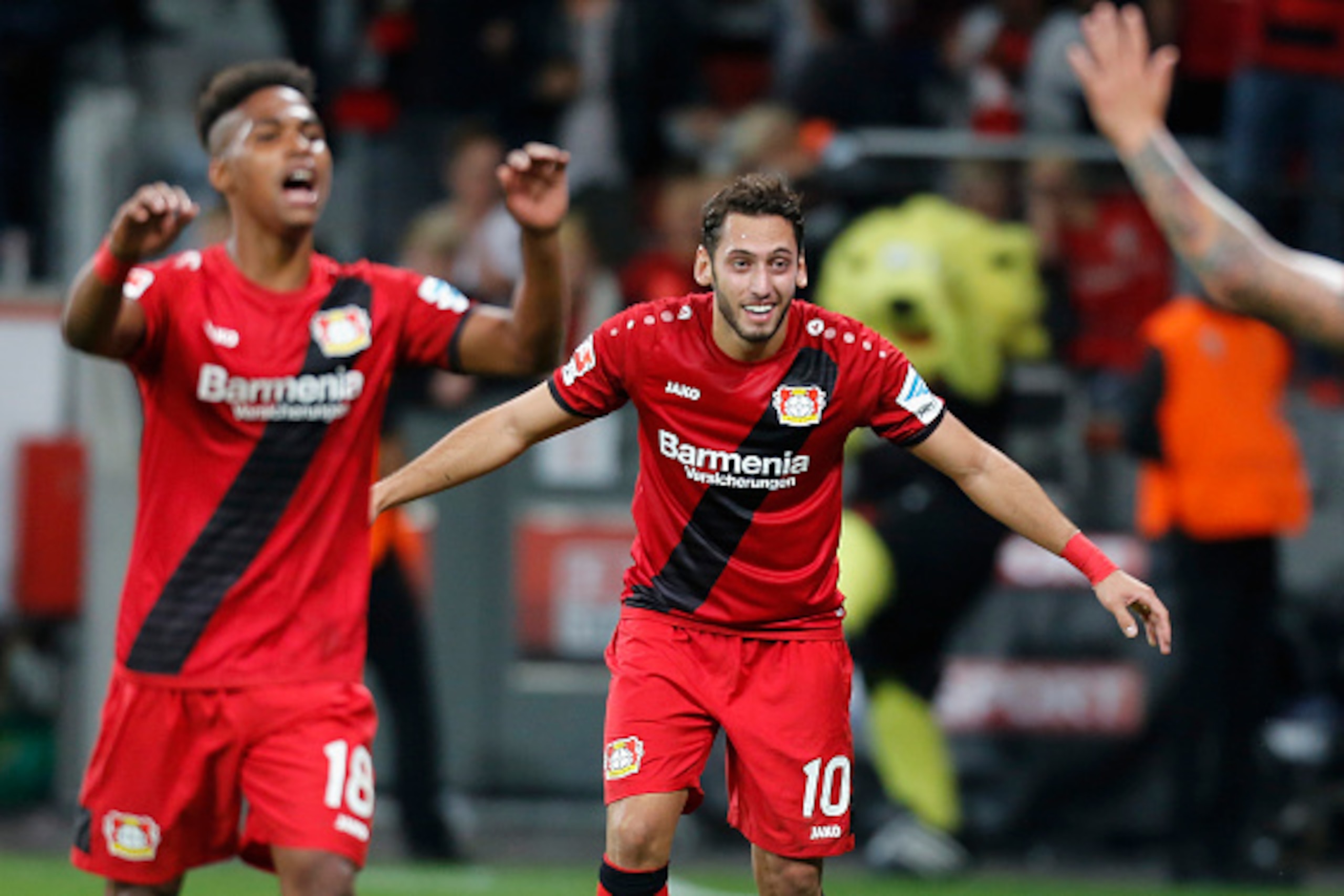 Leverkusen, Germany 01.10.2016, 1. Bundesliga 6. Spieltag, Bayer 04 Leverkusen - Borussia Dortmund, Torjubel Hakan Calhanoglu (Leverkusen, R) mit Wendell.      (Photo by TF-Images/Getty Images)