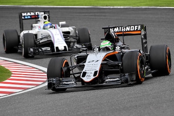 Sahara Force India F1 Team's German driver Nico Hulkenberg (R) leads Williams Martini Racing's Brazilian driver Felipe Massa (L) at the Formula One Japanese Grand Prix in Suzuka on October 9, 2016. / AFP / TOSHIFUMI KITAMURA        (Photo credit should re