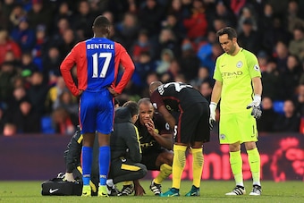 LONDON, ENGLAND - NOVEMBER 19: Vincent Kompany of Manchester City receives treatment from the medical team during the Premier League match between Crystal Palace and Manchester City at Selhurst Park on November 19, 2016 in London, England.  (Photo by Step