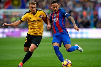 BARCELONA, SPAIN - NOVEMBER 19:  Neymar JR of Barcelona competes for the ball with Ontiveros (L) of Malaga during the La Liga match between FC Barcelona and Malaga CF at Camp Nou stadium on November 19, 2016 in Barcelona, Spain.  (Photo by Manuel Queimade