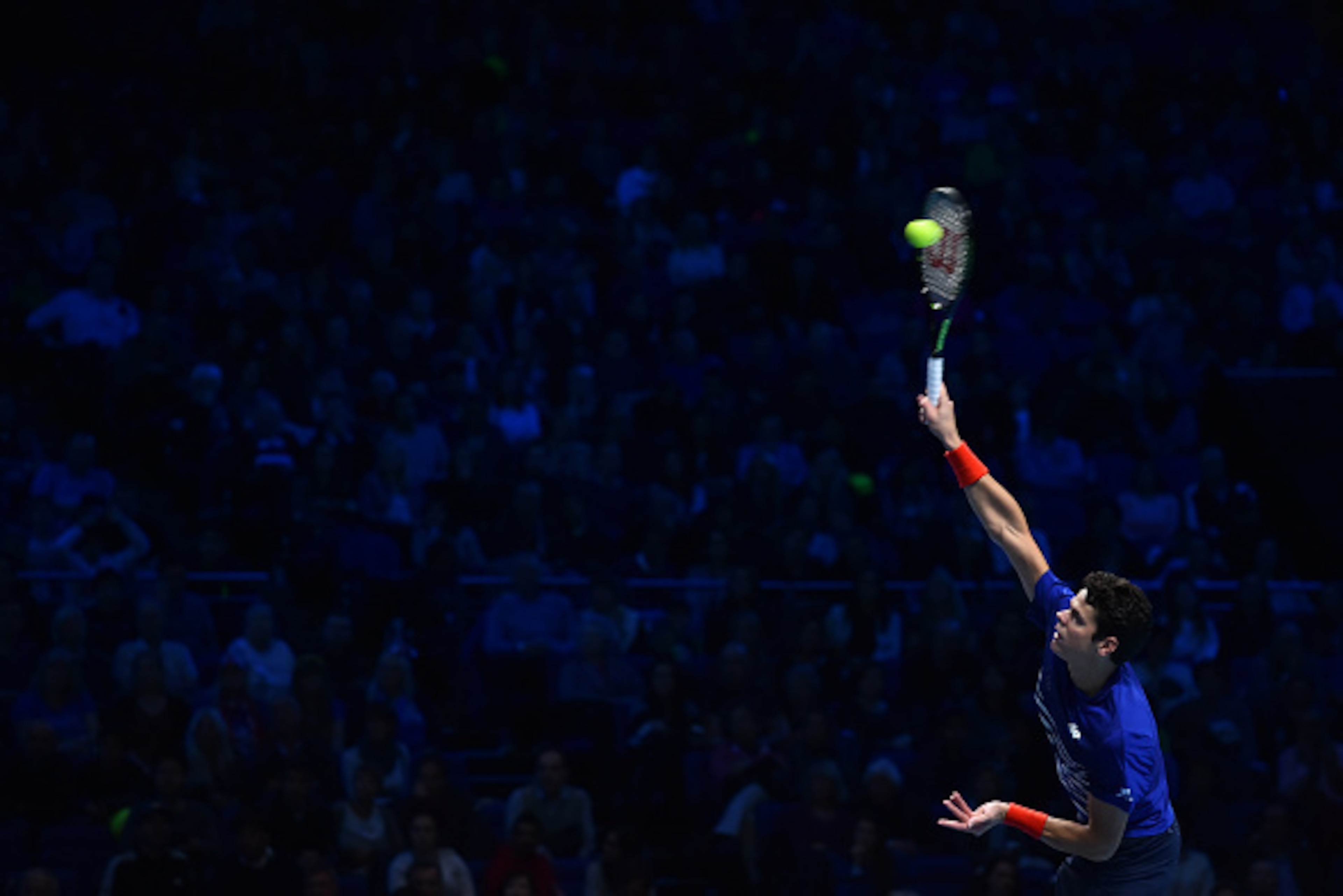 Canada's Milos Raonic serves against Britain's Andy Murray during their men's semi-final singles match on day seven of the ATP World Tour Finals tennis tournament in London on November 19, 2016. / AFP / Glyn KIRK        (Photo credit should read GLYN KIRK
