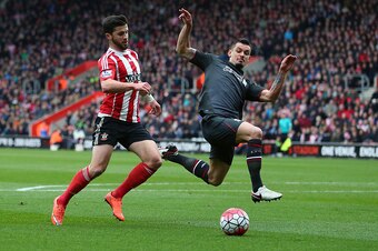 SOUTHAMPTON, ENGLAND - MARCH 20:  Dejan Lovren of Liverpool defends from Shane Long of Southampton
 during the Barclays Premier League match between Southampton and Liverpool on March 20, 2016 in Southampton, United Kingdom.  (Photo by Catherine Ivill - A