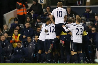 Tottenham players mob Winks after his equaliser.