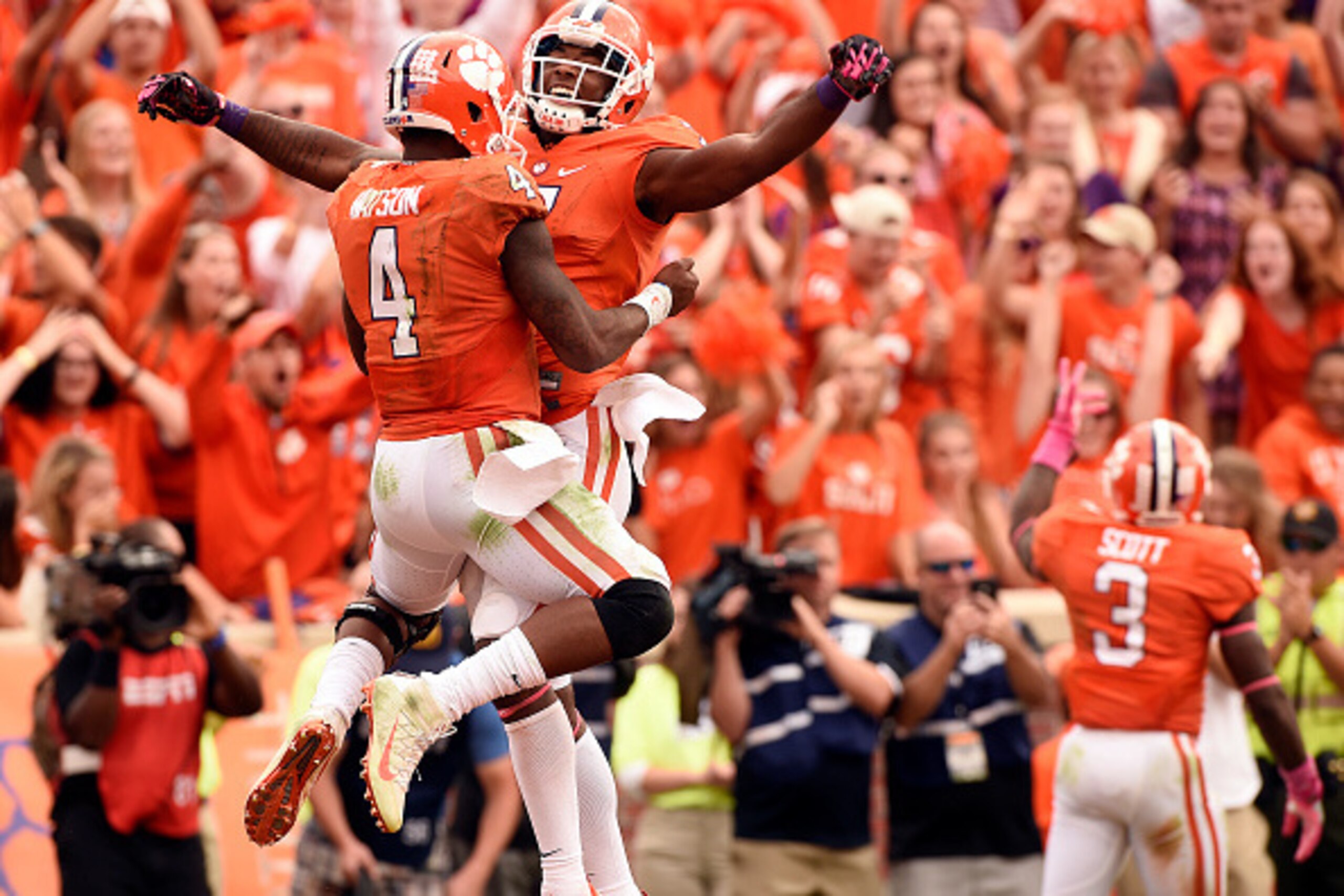 CLEMSON, SC - OCTOBER 15: Quarterback Deshaun Watson #4 of the Clemson Tigers and wide receiver Mike Williams #7 celebrate after a touchdown against the North Carolina State Wolfpack in overtime on October 15, 2016 at Memorial Stadium in Clemson, South Ca
