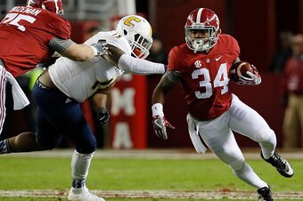 TUSCALOOSA, AL - NOVEMBER 19:  Damien Harris #34 of the Alabama Crimson Tide rushes away from Derek Mahaffey #15 of the Chattanooga Mocs at Bryant-Denny Stadium on November 19, 2016 in Tuscaloosa, Alabama.  (Photo by Kevin C. Cox/Getty Images)
