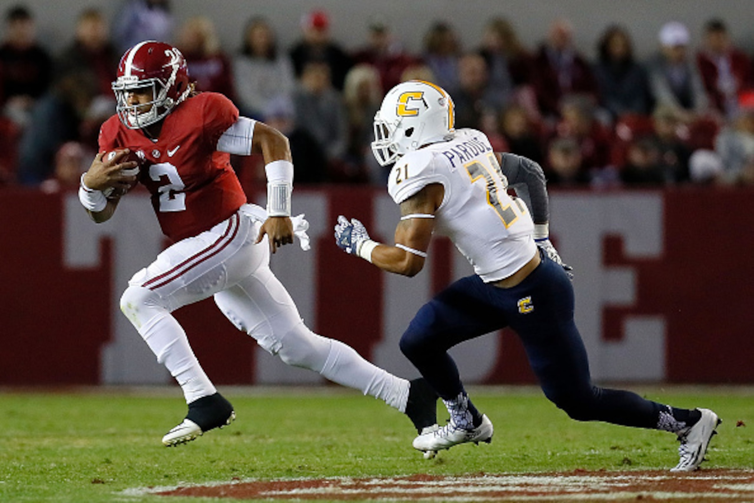 TUSCALOOSA, AL - NOVEMBER 19:  Jalen Hurts #2 of the Alabama Crimson Tide rushes away from Montrell Pardue #21 of the Chattanooga Mocs at Bryant-Denny Stadium on November 19, 2016 in Tuscaloosa, Alabama.  (Photo by Kevin C. Cox/Getty Images)