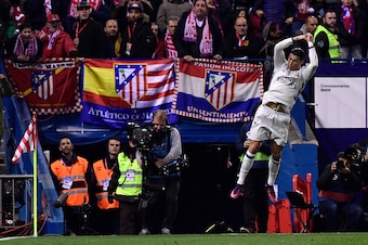 TOPSHOT - Real Madrid's Portuguese forward Cristiano Ronaldo celebrates a goal during the Spanish league football match between Club Atletico de Madrid and Real Madrid CF at the Vicente Calderon stadium in Madrid, on November 19, 2016. / AFP / GERARD JULI