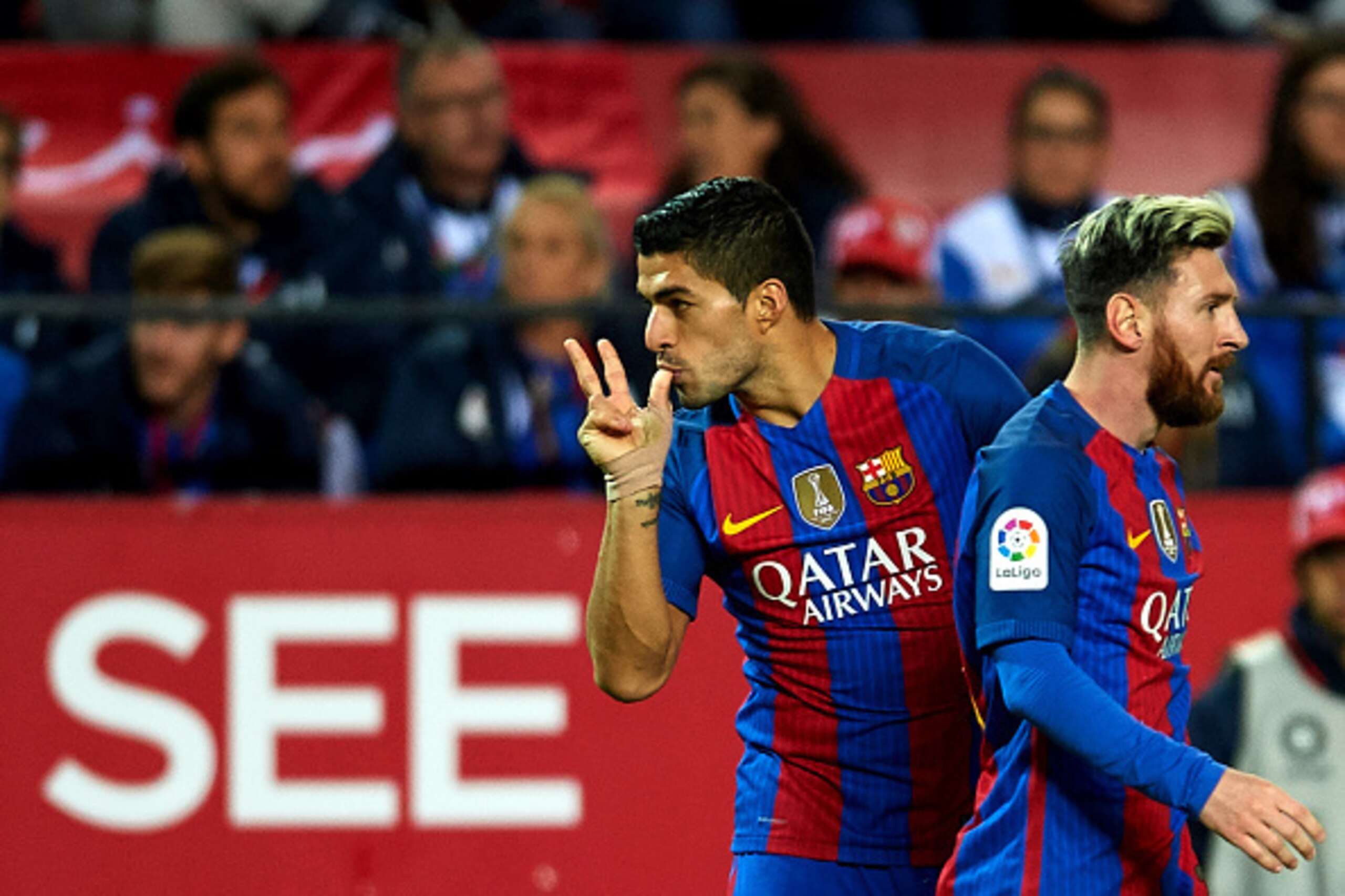SEVILLE, SPAIN - NOVEMBER 06:  Luis Suarez of FC Barcelona  celebrates after scoring with his team mate Lionel Messi of FC Barcelona  during the match between Sevilla FC vs FC Barcelona as part of La Liga at Ramon Sanchez Pizjuan Stadium on November 6, 20