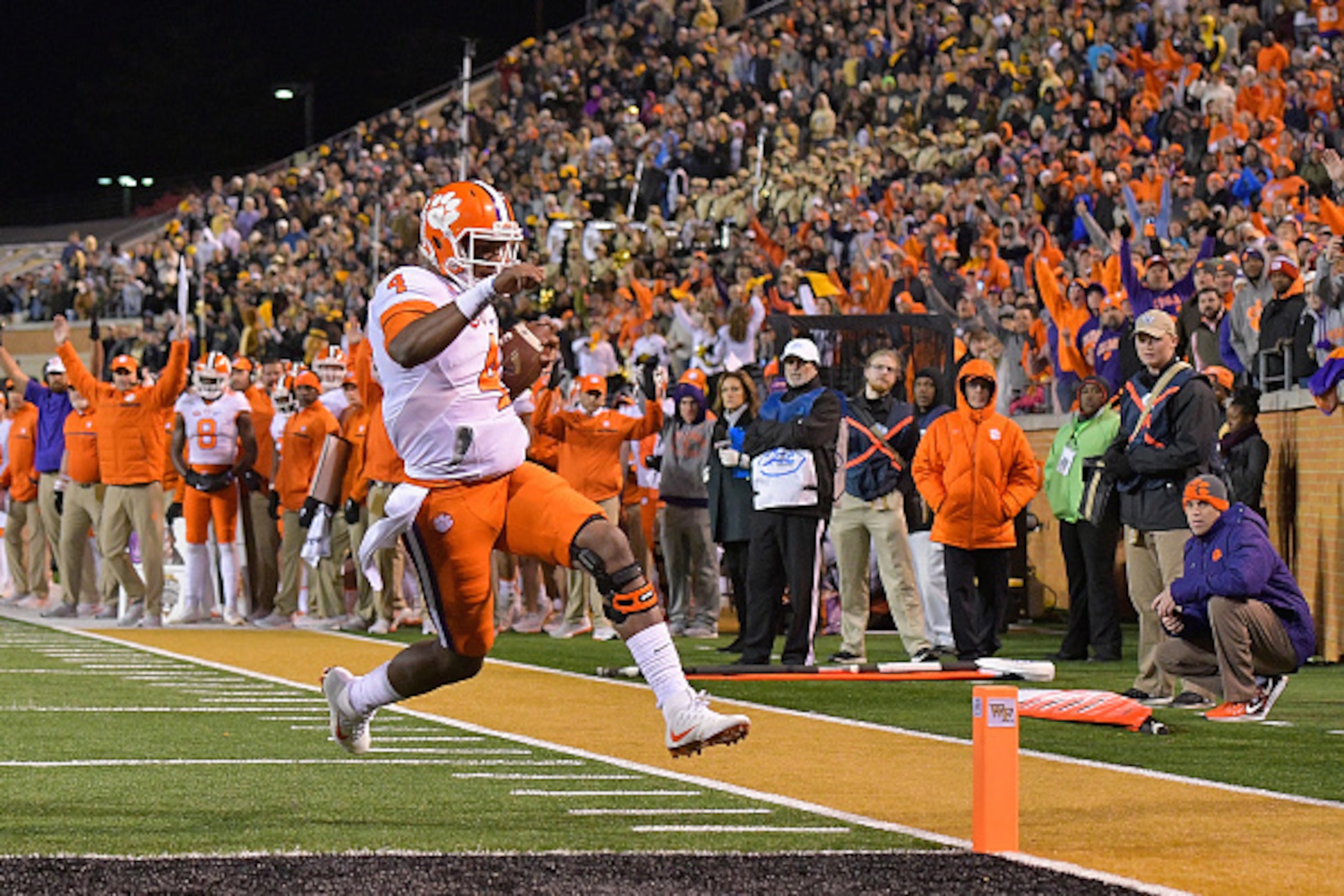 WINSTON SALEM, NC - NOVEMBER 19:  Deshaun Watson #4 of the Clemson Tigers scores a touchdown against the Wake Forest Demon Deacons during the game at BB&T Field on November 19, 2016 in Winston Salem, North Carolina.  (Photo by Grant Halverson/Getty Images
