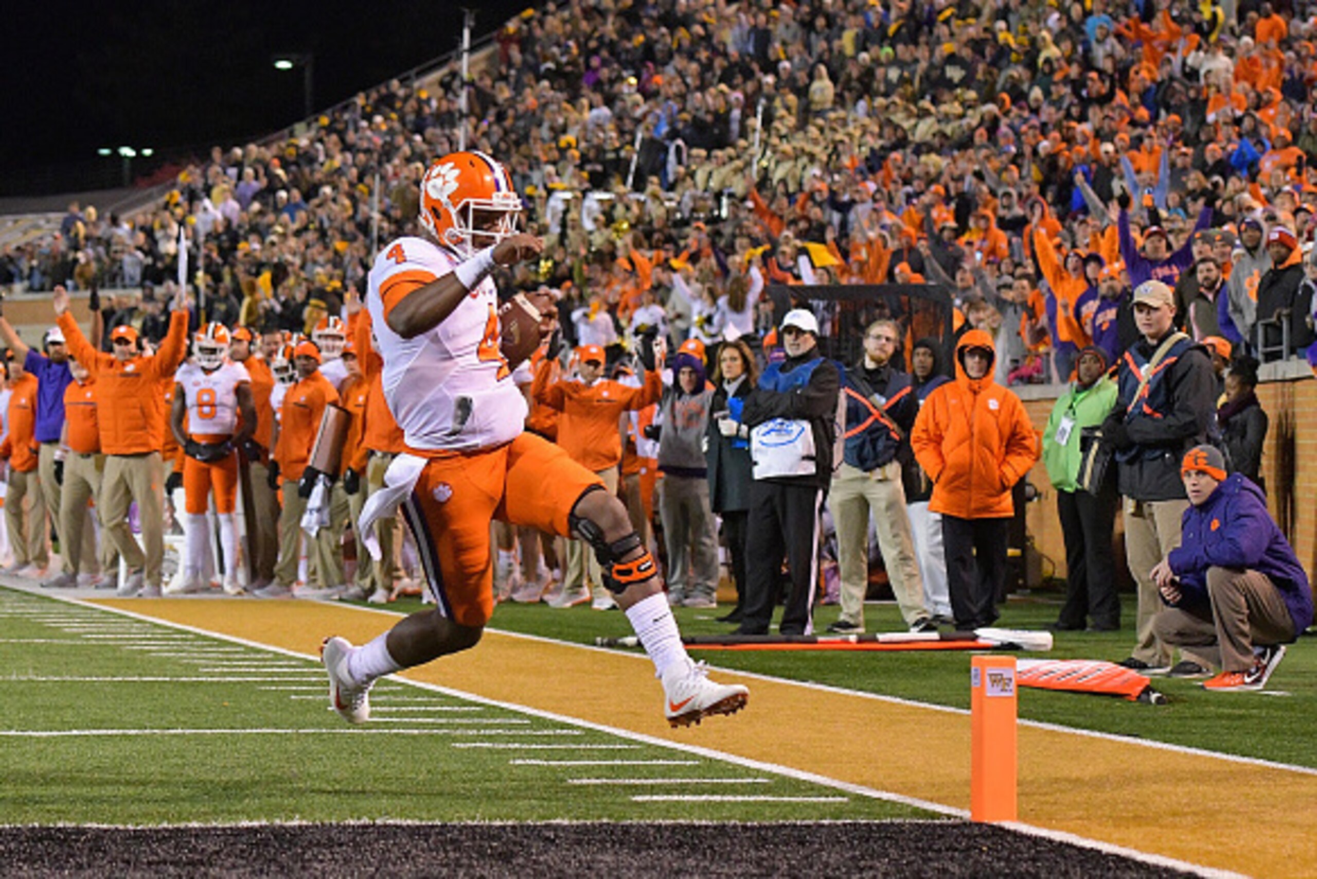 WINSTON SALEM, NC - NOVEMBER 19:  Deshaun Watson #4 of the Clemson Tigers scores a touchdown against the Wake Forest Demon Deacons during the game at BB&T Field on November 19, 2016 in Winston Salem, North Carolina.  (Photo by Grant Halverson/Getty Images