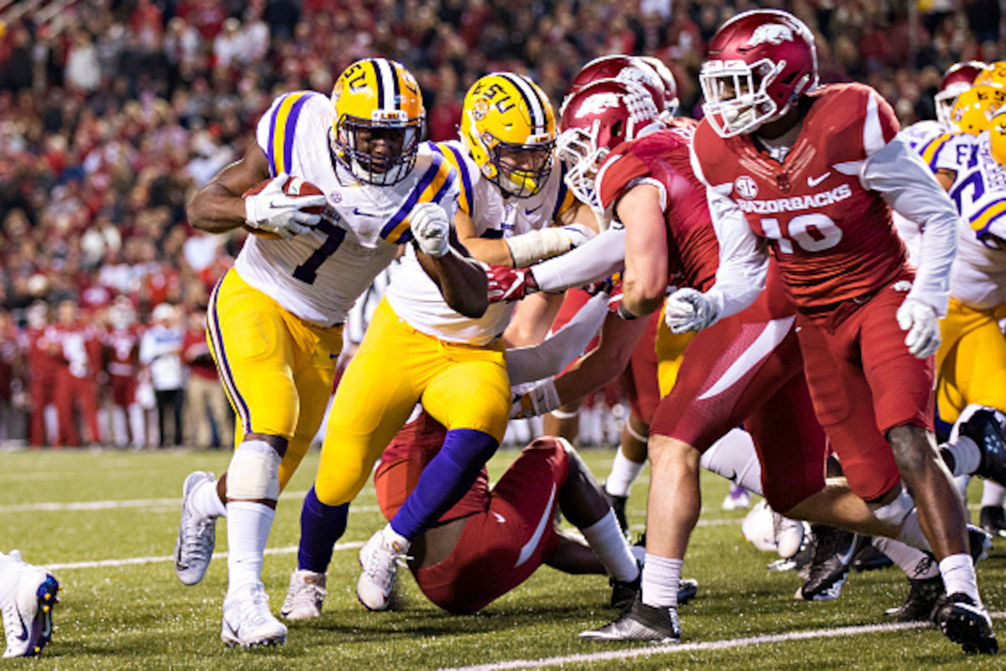 FAYETTEVILLE, AR - NOVEMBER 12:  Leonard Fournette #7 of the LSU Tigers runs the ball in for a touchdown against the Arkansas Razorbacks at Razorback Stadium on November 12, 2016 in Fayetteville, Arkansas.  The Tigers defeated the Razorbacks 38-10.  (Phot