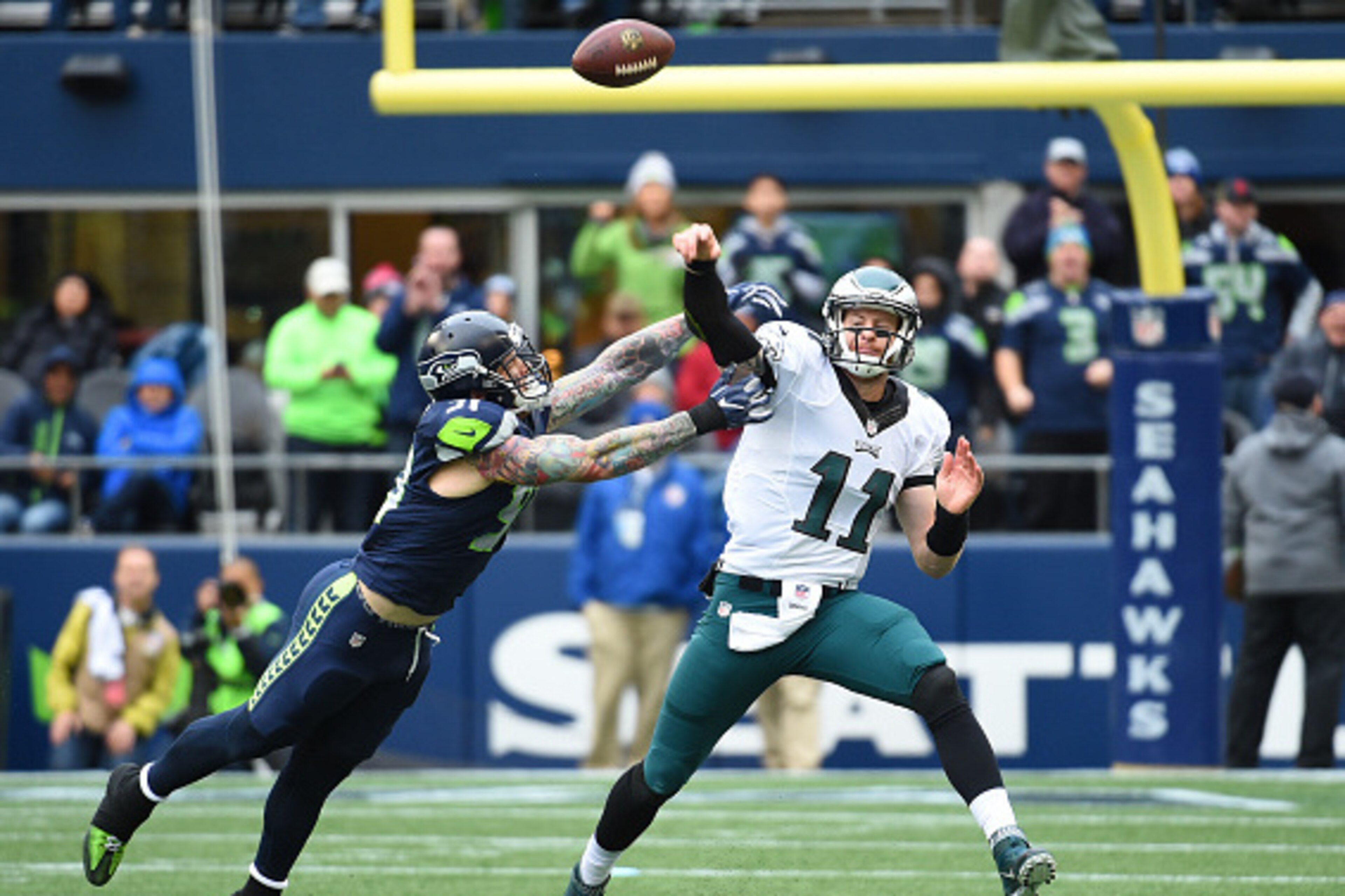 SEATTLE, WA - NOVEMBER 20:  Quarterback Carson Wentz #11 of the Philadelphia Eagles passes against the Seattle Seahawks at CenturyLink Field on November 20, 2016 in Seattle, Washington.  (Photo by Steve Dykes/Getty Images)