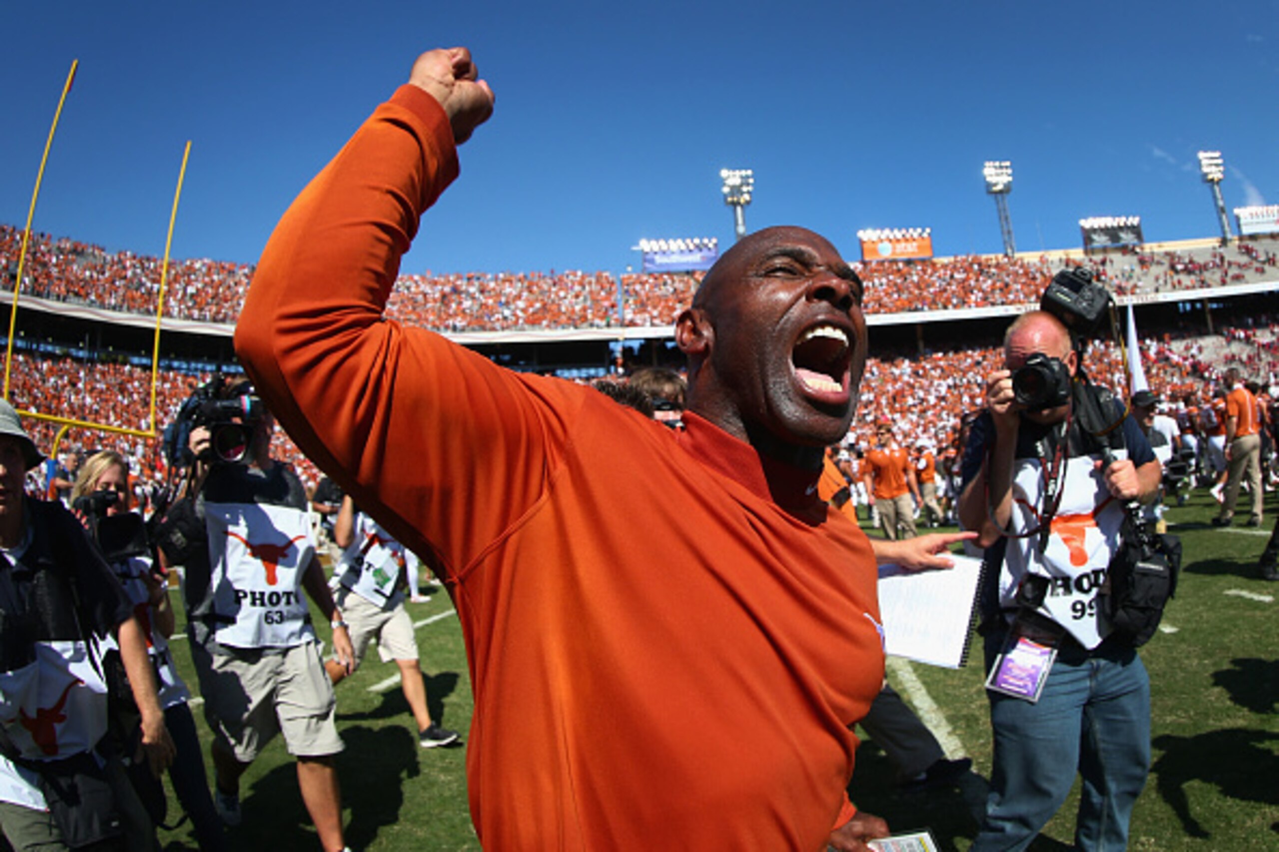 DALLAS, TX - OCTOBER 10:  Head coach Charlie Strong of the Texas Longhorns celebrates after the Longhorns beat the Oklahoma Sooners 24-17 during the AT&T Red River Showdown at the Cotton Bowl on October 10, 2015 in Dallas, Texas.  (Photo by Tom Pennington