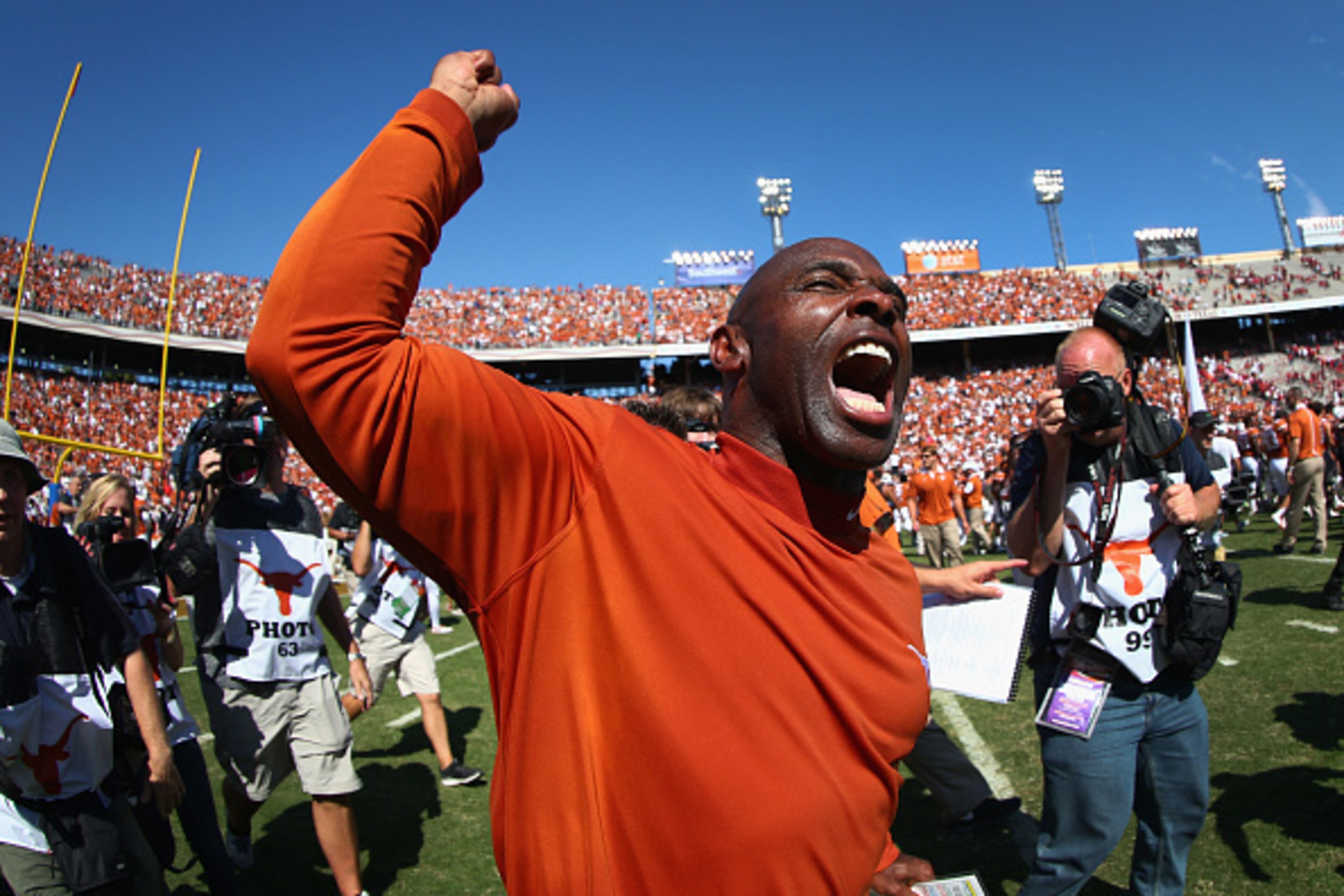 DALLAS, TX - OCTOBER 10:  Head coach Charlie Strong of the Texas Longhorns celebrates after the Longhorns beat the Oklahoma Sooners 24-17 during the AT&T Red River Showdown at the Cotton Bowl on October 10, 2015 in Dallas, Texas.  (Photo by Tom Pennington