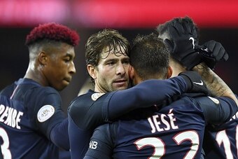 Paris Saint-Germain's Spain's  forward Rodriguez Jese (2ndR) is congratuled by Brazilian defender teammate Maxwell after he scored a goal during the French L1 football match between Paris Saint-Germain and Nantes at the Parc des Princes stadium in Paris o