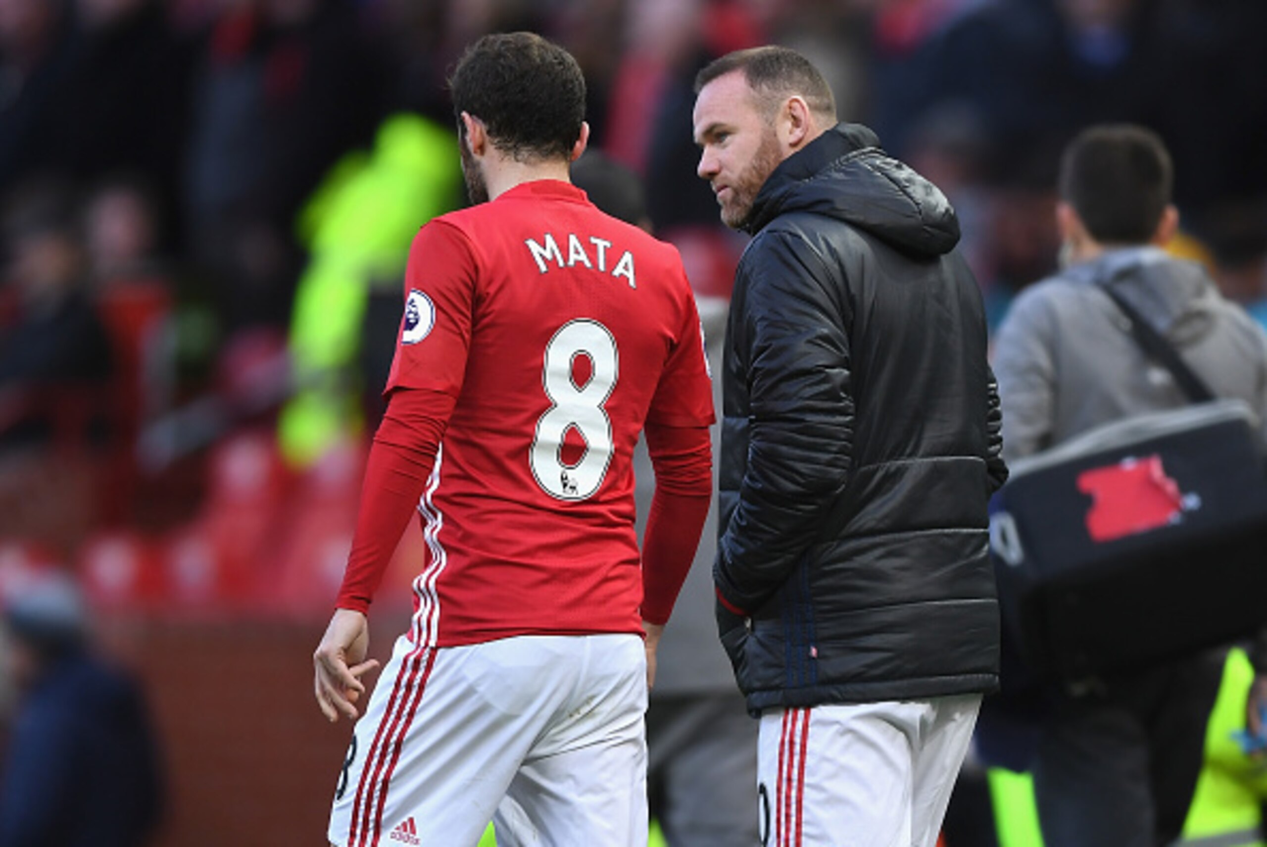 MANCHESTER, ENGLAND - NOVEMBER 19:  Juan Mata of Manchester United (L) speaks to Wayne Rooney of Manchester United (R) during the Premier League match between Manchester United and Arsenal at Old Trafford on November 19, 2016 in Manchester, England.  (Pho