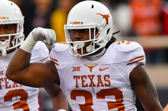 LUBBOCK, TX - NOVEMBER 05: D'Onta Foreman #33 of the Texas Longhorns reacts to scoring a touchdown during the first half of the game between the Texas Tech Red Raiders and the Texas Longhorns on November 5, 2016 at AT&T Jones Stadium in Lubbock, Texas. (P