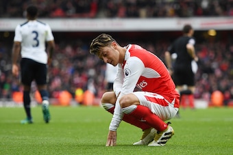 LONDON, ENGLAND - NOVEMBER 06:  Mesut Ozil of Arsenal reacts during the Premier League match between Arsenal and Tottenham Hotspur at Emirates Stadium on November 6, 2016 in London, England.  (Photo by Shaun Botterill/Getty Images)