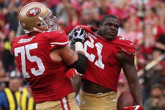 SAN FRANCISCO, CA - OCTOBER 06:  Frank Gore #21 of the San Francisco 49ers celebrates with Alex Boone #75 after scoring a touchdown in the first quarter against the Houston Texans at Candlestick Park on October 6, 2013 in San Francisco, California. The 49
