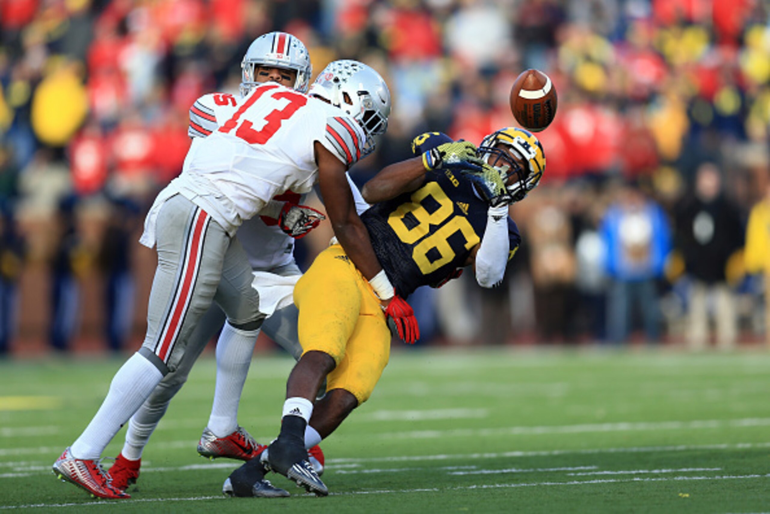 ANN ARBOR, MI - NOVEMBER 28: Wide receiver Jehu Chesson #86 of the Michigan Wolverines looks to make a catch while cornerback Eli Apple #13 of the Ohio State Buckeyes defends during the game at Michigan Stadium on November 28, 2015 in Ann Arbor, Michigan.