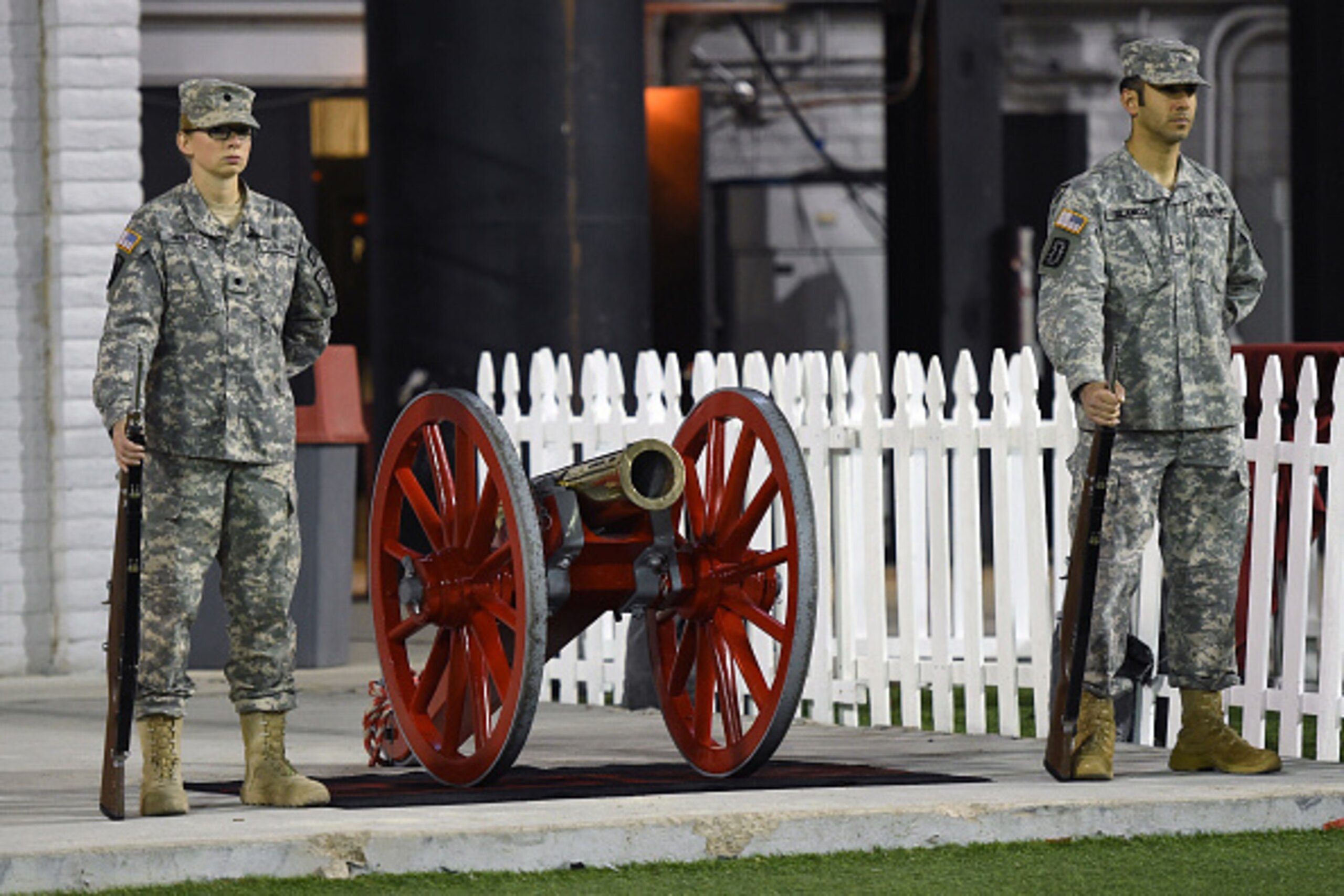 LAS VEGAS, NV - NOVEMBER 29:  Members of the US Army stand guard next to the Fremont Cannon trophy late in the game between the Nevada Wolf Pack and the UNLV Rebels at Sam Boyd Stadium on November 29, 2014 in Las Vegas, Nevada. Nevada won the trophy with 