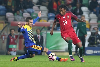 AVEIRO, PORTUGAL - OCTOBER 7: Portugal's forward Gelson Martins (R) with Andorra's midfielder Cristian Martinez (L) in action during the FIFA 2018 World Cup Qualifier match between Portugal and Andorra at Estadio Municipal de Aveiro on October 7, 2016 in 