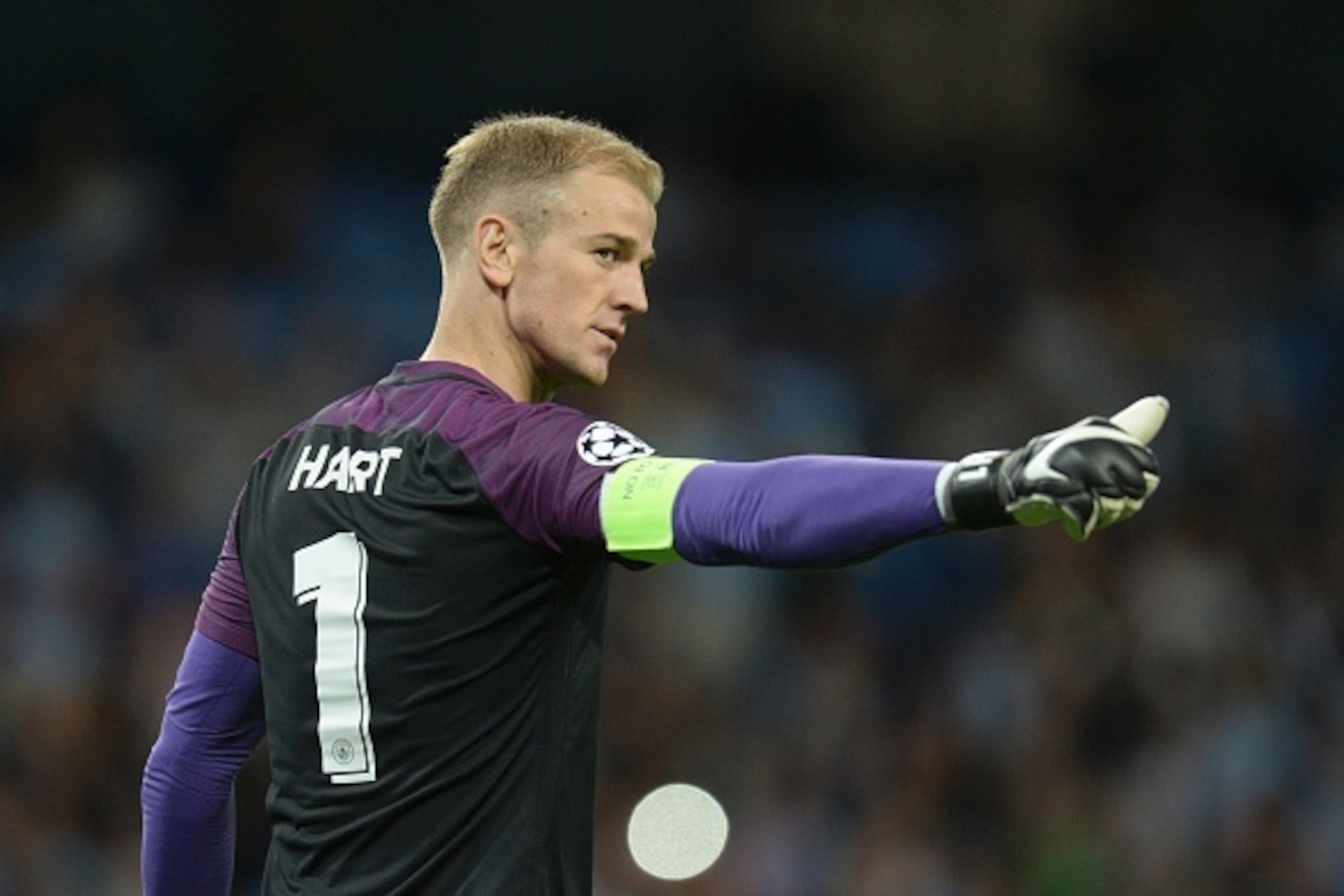 Manchester City's English goalkeeper Joe Hart gestures to members of the crowd as he comes out for the second half during the UEFA Champions league second leg play-off football match between Manchester City and Steaua Bucharest at the Etihad Stadium in Ma