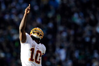 PHILADELPHIA, PA - DECEMBER 23: Robert Griffin III #10 of the Washington Redskins celebrates after Josh Morgan #15 scored a touchdown against the Philadelphia Eagles during the first half at Lincoln Financial Field on December 23, 2012 in Philadelphia, Pe