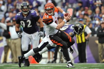 BALTIMORE - NOVEMBER 20:  Andy Dalton #14 of the Cincinnati Bengals scrambles against the Baltimore Ravens at M&T Bank Stadium on November 20, 2011 in Baltimore, Maryland. The Ravens defeated the Bengals 31-24. (Photo by Larry French/Getty Images)