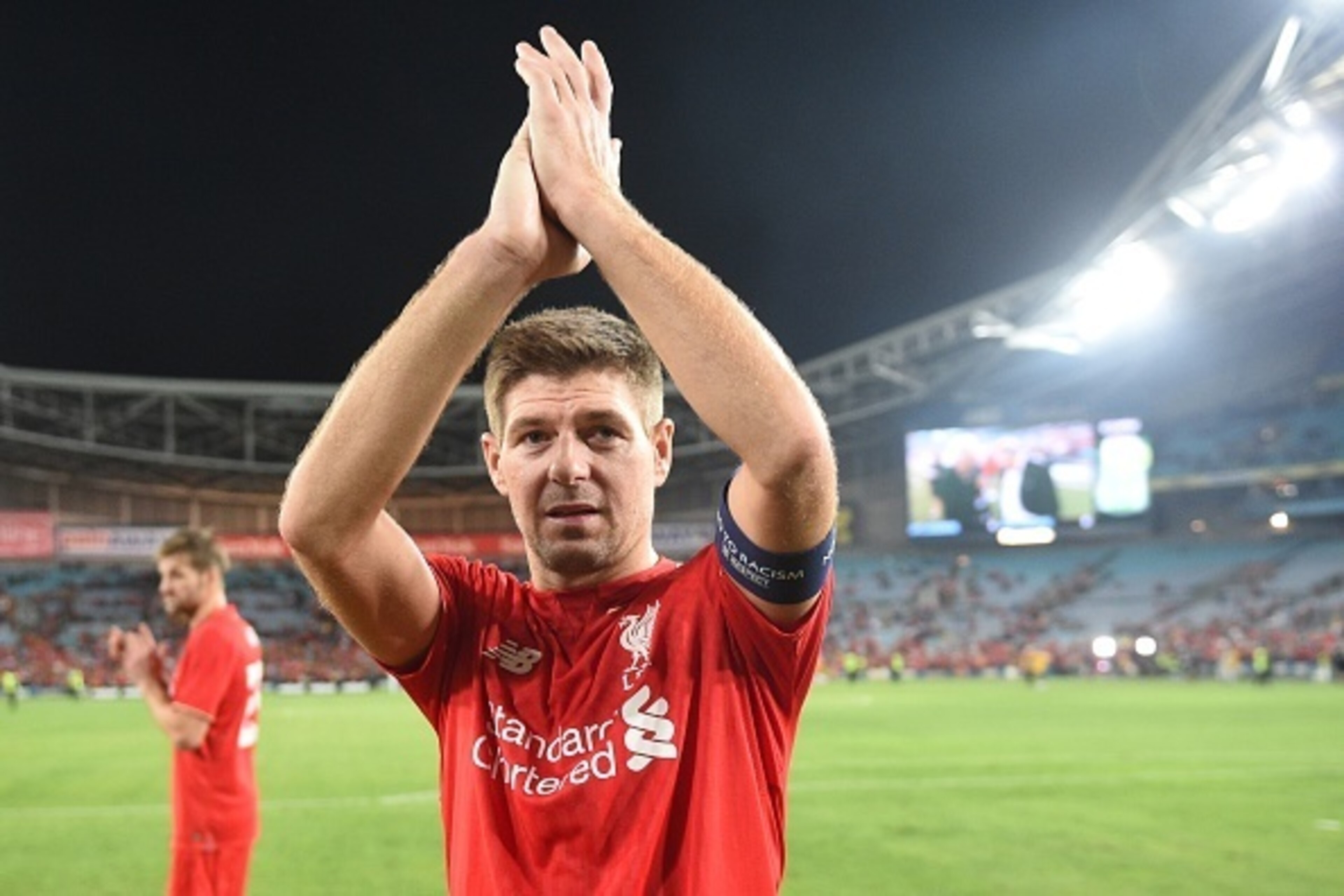 Former Liverpool football star Steven Gerrard applauds the fans after playing for Liverpool Legends against Australian Legends in an exhibition football game at the ANZ Stadium in Sydney on January 7, 2016. AFP PHOTO / Peter PARKS IMAGE STRICTLY FOR ED Former Liverpool football star Steven Gerrard applauds the fans after playing for Liverpool Legends against Australian Legends in an exhibition football game at the ANZ Stadium in Sydney on January 7, 2016. AFP PHOTO / Peter PARKS IMAGE STRICTLY FOR ED