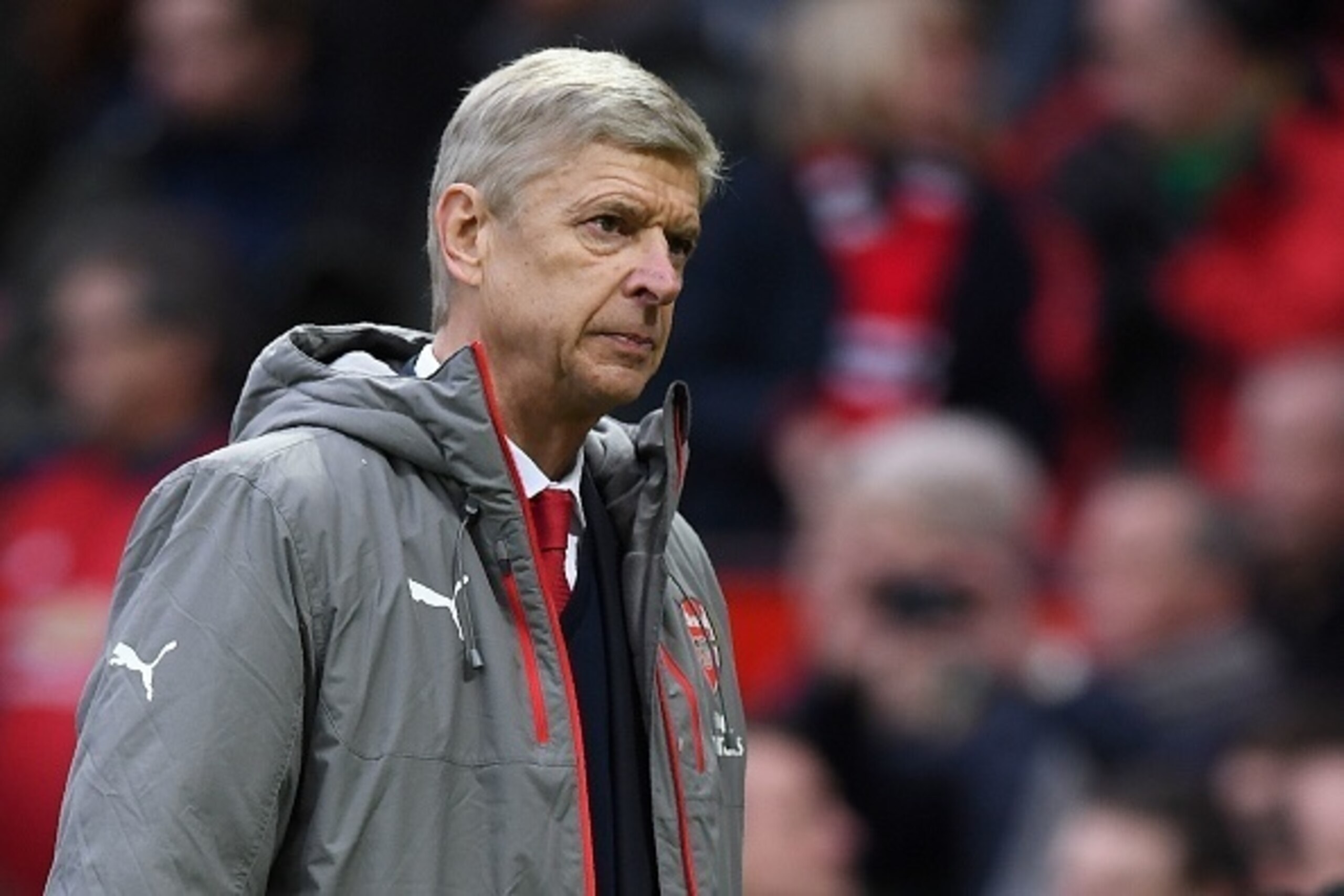 Arsenal's French manager Arsene Wenger leaves the pitch following the English Premier League football match between Manchester United and Arsenal at Old Trafford in Manchester, north west England, on November 19, 2016.
The match ended in a draw at 1-1. / 
