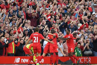 LIVERPOOL, ENGLAND - SEPTEMBER 10:  Sadio Mane of Liverpool celebrates scoring his sides second goal with team mates during the Premier League match between Liverpool and Leicester City at Anfield on September 10, 2016 in Liverpool, England.  (Photo by Mi