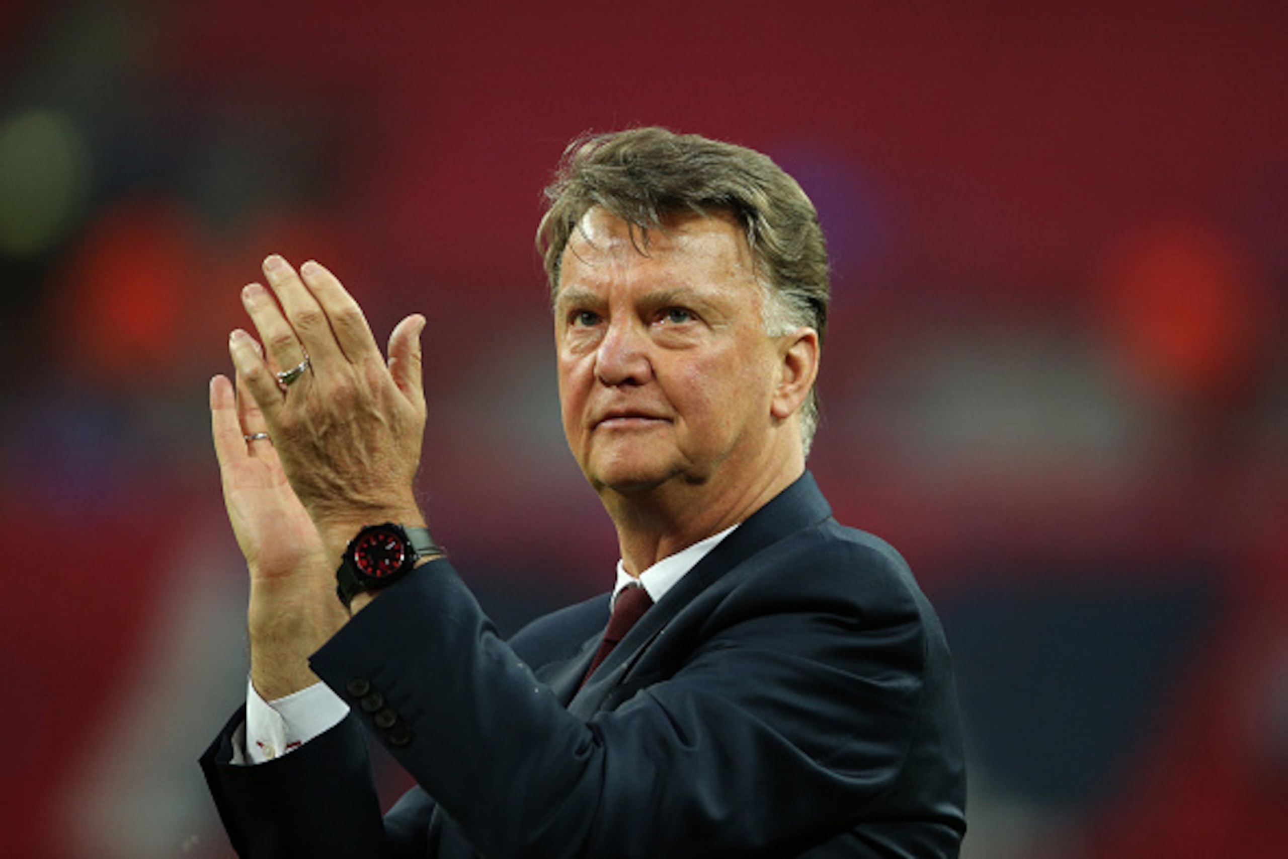 LONDON, ENGLAND - MAY 21: LONDON, ENGLAND - MAY 21: Louis van Gaal Manager / head coach of Manchester United watches his players celebrate victory after The Emirates FA Cup final match between Manchester United and Crystal Palace at Wembley Stadium on May LONDON, ENGLAND - MAY 21: LONDON, ENGLAND - MAY 21: Louis van Gaal Manager / head coach of Manchester United watches his players celebrate victory after The Emirates FA Cup final match between Manchester United and Crystal Palace at Wembley Stadium on May