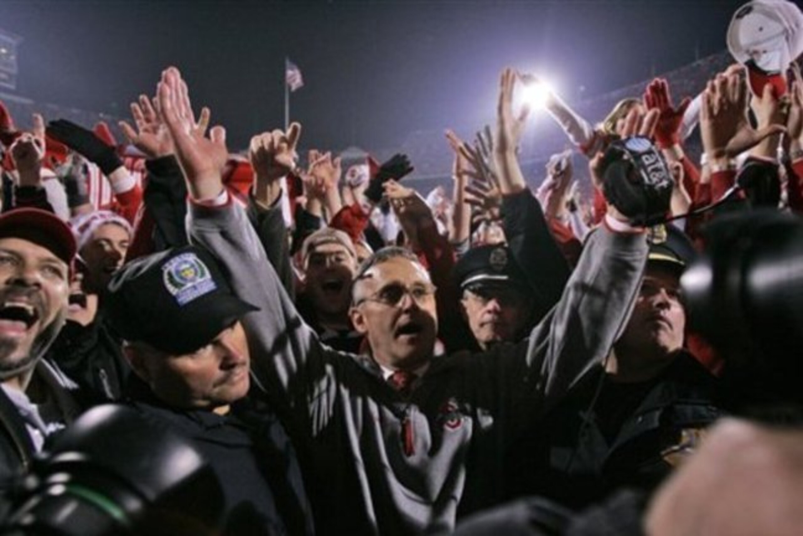 Ohio State coach Jim Tressel celebrates the win over Michigan with fans.