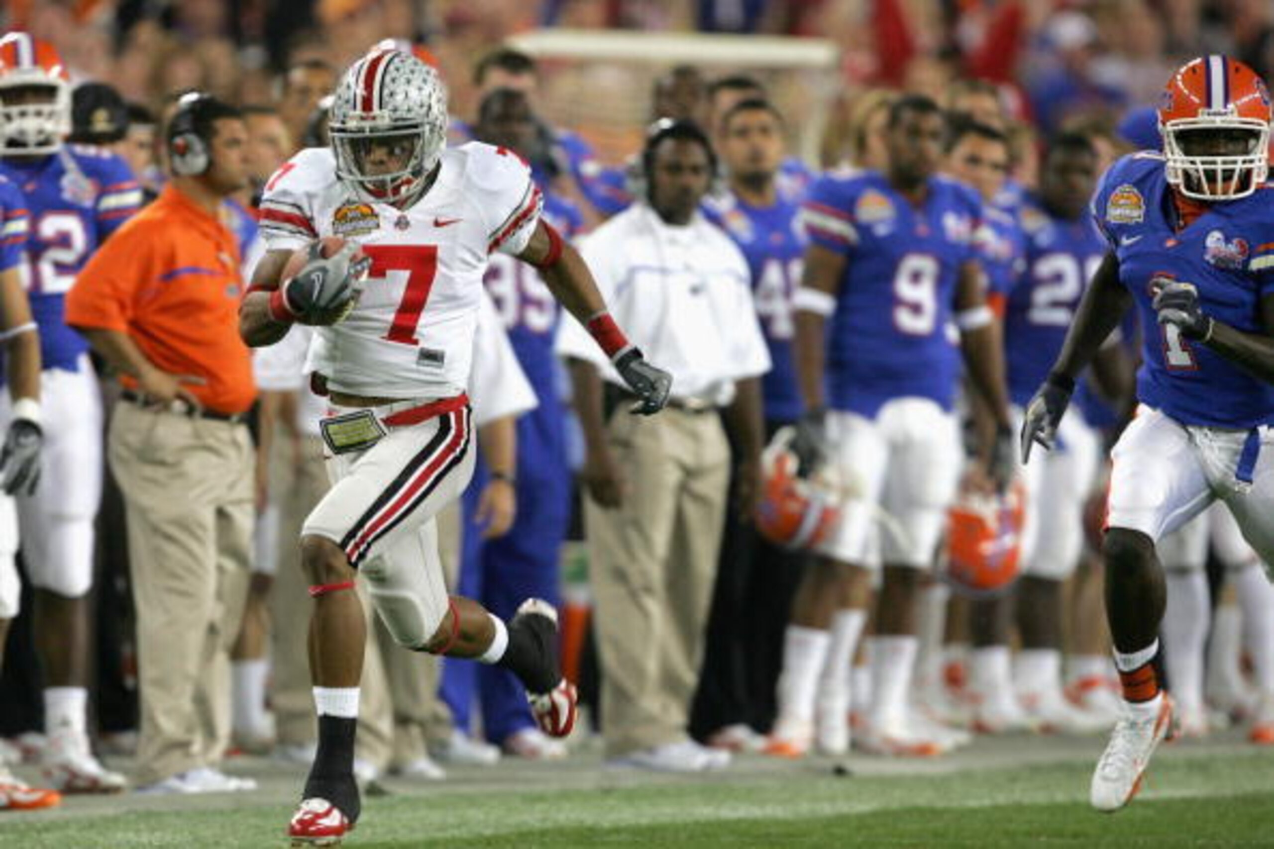 GLENDALE, AZ - JANUARY 08:  Ted Ginn Jr. #7 of the Ohio State Buckeyes returns the opening kickoff for a 93 yard touchdown run against the Florida Gators during the first quarter of the 2007 Tostitos BCS National Championship Game at the University of Pho