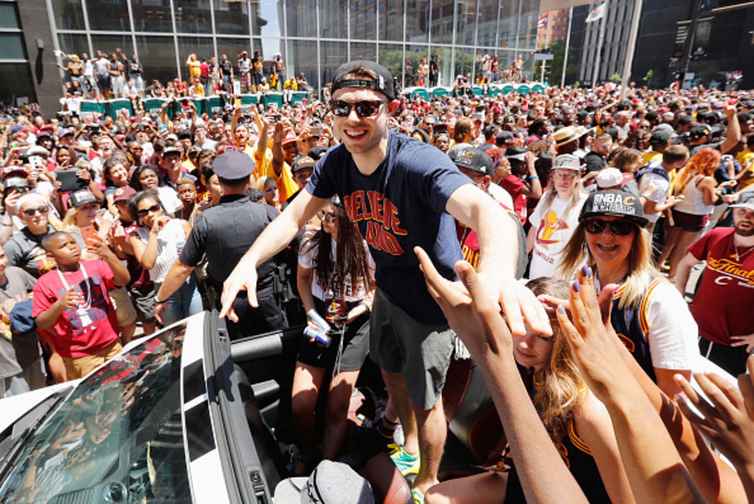 CLEVELAND, OH - JUNE 22:  Matthew Dellavedova #8 of the Cleveland Cavaliers waves at fans during the Cleveland Cavaliers Victory Parade And Rally on June 22, 2016 in downtown Cleveland, Ohio.  NOTE TO USER: User expressly acknowledges and agrees that, by 
