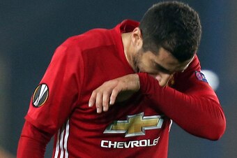 Manchester United's Armenian midfielder Henrikh Mkhitaryan reacts after the UEFA Europa League Group A football match Fenerbahce SK vs Manchester United at the Fenerbahce Ulker Stadium on November 3, 2016 in Istanbul.  
Fenerbahce won the match 2-1. / AFP