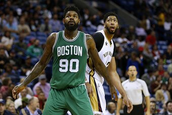 NEW ORLEANS, LA - NOVEMBER 14: Anthony Davis #23 of the New Orleans Pelicans and Amir Johnson #90 of the Boston Celtics go for a rebound during a game at the Smoothie King Center on November 14, 2016 in New Orleans, Louisiana. NOTE TO USER: User expressly