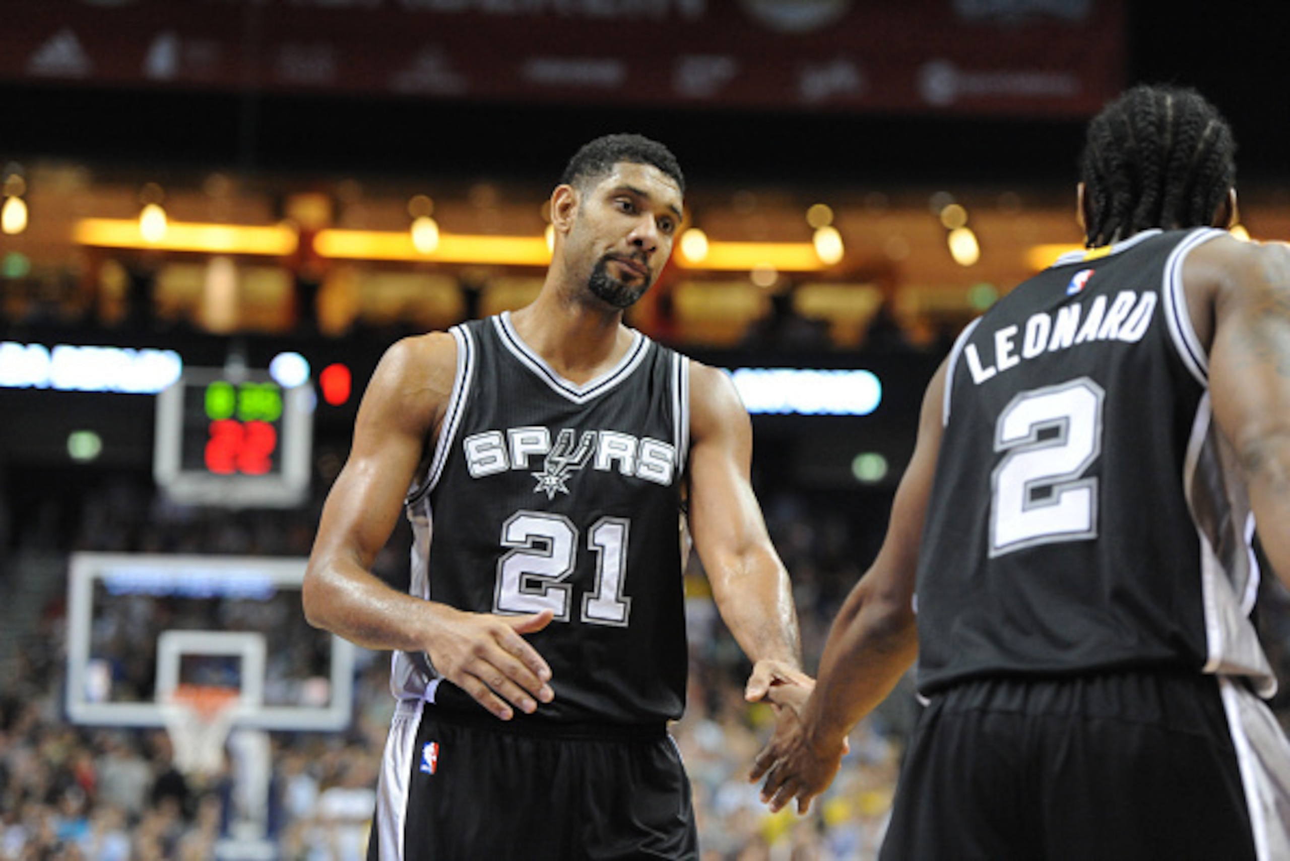 BERLIN - OCTOBER 8: Tim Duncan #21 and Kawhi Leonard #2 of the San Antonio Spurs shake hands against Alber Berlin during a game as part of the 2014 Global Games on October 8, 2014 at the O2 Arena in Berlin, Germany. NOTE TO USER: User expressly acknowledg