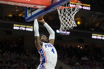 PHILADELPHIA, PA - MARCH 18: Nerlens Noel #4 of the Philadelphia 76ers dunks the ball against Steven Adams #12 of the Oklahoma City Thunder on March 18, 2016 at the Wells Fargo Center in Philadelphia, Pennsylvania. The Thunder defeated the 76ers 111-97. N