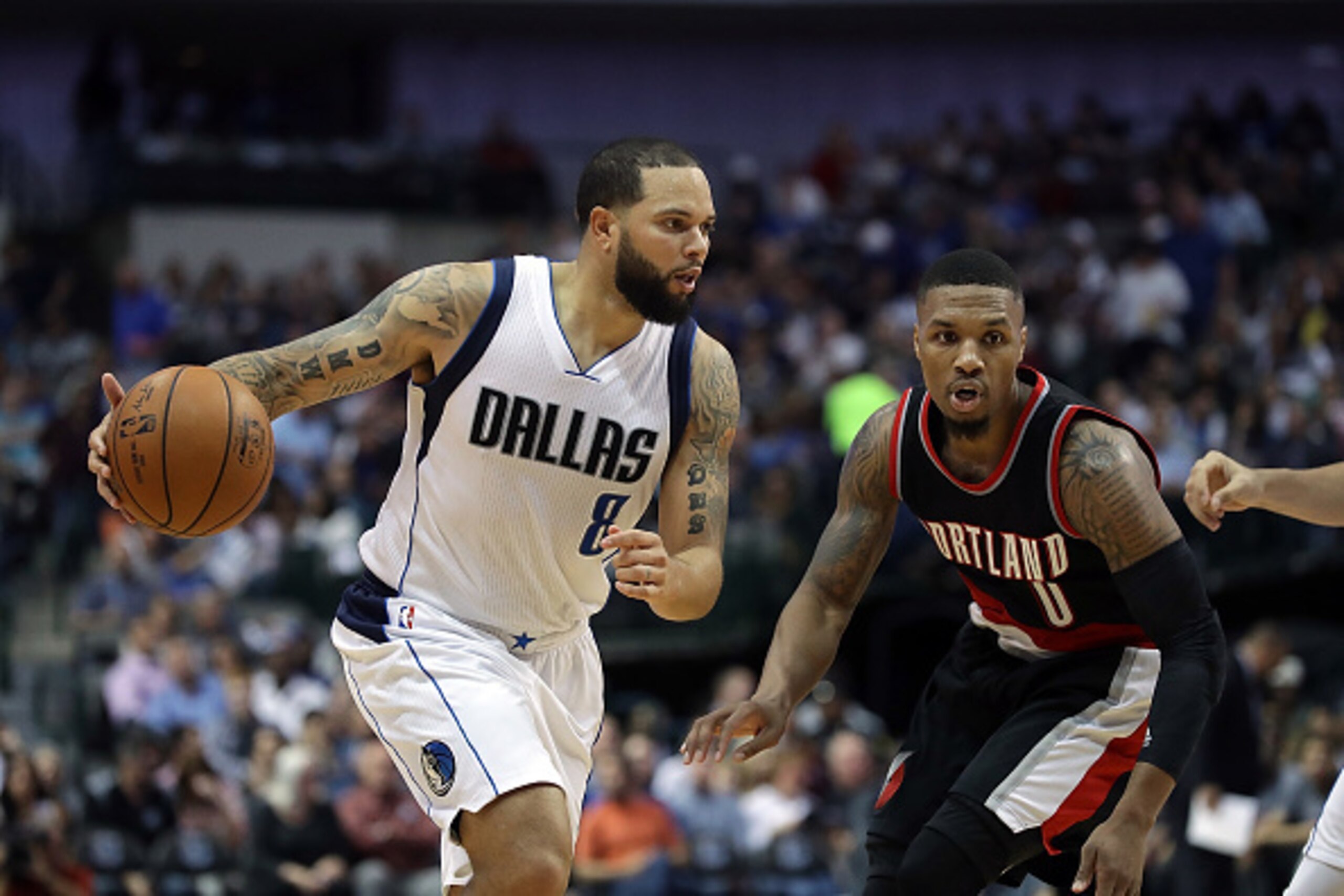 DALLAS, TX - NOVEMBER 04:  Deron Williams #8 of the Dallas Mavericks dribbles the ball against Damian Lillard #0 of the Portland Trail Blazers in the second half at American Airlines Center on November 4, 2016 in Dallas, Texas.  NOTE TO USER: User express