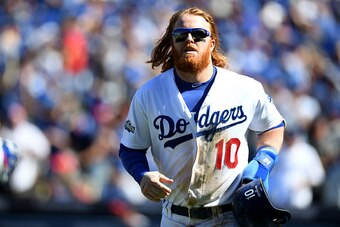 LOS ANGELES, CA - OCTOBER 10:  Justin Turner #10 of the Los Angeles Dodgers celebrates after scoring a run in the first inning against the Washington Nationals in game three of the National League Division Series at Dodger Stadium on October 10, 2016 in L