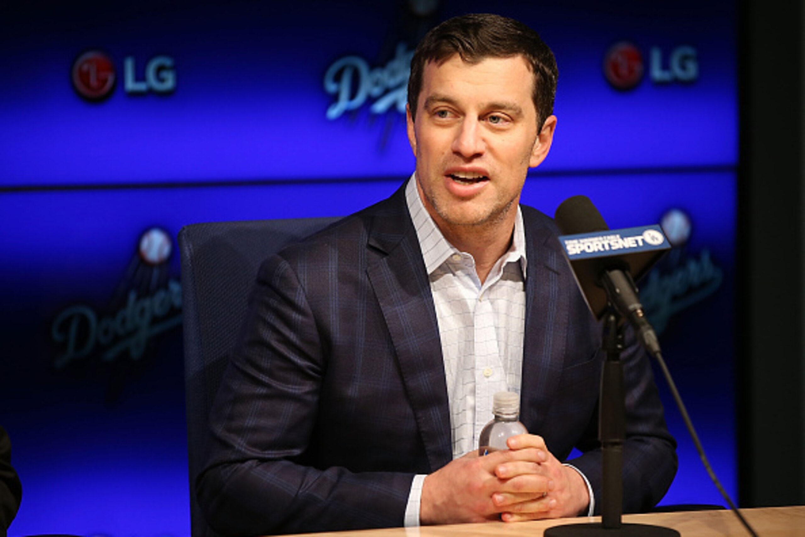 LOS ANGELES, CA - JANUARY 07:  Dodgers president of baseball operations Andrew Friedman introduces Pitcher Kenta Maeda to the Los Angeles Dodgers at Dodger Stadium on January 7, 2016 in Los Angeles, California.  (Photo by Joe Scarnici/Getty Images)