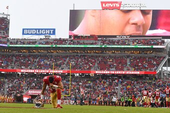 SANTA CLARA, CA - NOVEMBER 20:  Chris Harper #14 of the San Francisco 49ers kneels and prays in the endzone prior to the start of their NFL football game against the New England Patriots at Levi's Stadium on November 20, 2016 in Santa Clara, California.  